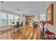 Open dining area with hardwood floors, stylish lighting, and a view of the kitchen at 18119 Coulter Pkwy, Cornelius, NC 28031