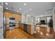 Open concept kitchen boasting stainless steel appliances and granite countertops at 18119 Coulter Pkwy, Cornelius, NC 28031