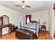 Bedroom featuring a bed, wood floors, ceiling fan, and a vintage desk and mirror at 1830 Light Brigade Dr, Matthews, NC 28105