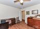 Bedroom with hardwood floors, ceiling fan, and furniture at 1830 Light Brigade Dr, Matthews, NC 28105