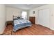 Bright bedroom features wood floors, a decorative bed frame, and ample natural light at 1830 Light Brigade Dr, Matthews, NC 28105