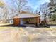 Brick carport with open space for parking, plus space for outdoor grilling at 1830 Light Brigade Dr, Matthews, NC 28105