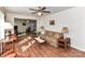 Spacious living room features wood floors, open layout with vintage decor, and comfortable seating at 1830 Light Brigade Dr, Matthews, NC 28105