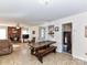 Inviting living room with a cozy brick fireplace and rustic wooden table at 1830 Light Brigade Dr, Matthews, NC 28105