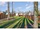 Private backyard with a wooden fence and green lawn at 1906 Lakedell Dr, Charlotte, NC 28215