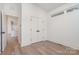 Bright bedroom with hardwood floors and spacious closet at 1906 Lakedell Dr, Charlotte, NC 28215