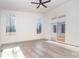 Bright bedroom with hardwood floors and sliding doors to deck at 1906 Lakedell Dr, Charlotte, NC 28215