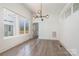 Bright dining room features hardwood floors and large windows at 1906 Lakedell Dr, Charlotte, NC 28215