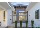 Modern home's front entrance with gray and white exterior at 1906 Lakedell Dr, Charlotte, NC 28215