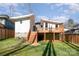 Modern house exterior with a wooden deck and stairs at 1906 Lakedell Dr, Charlotte, NC 28215