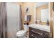 Neat bathroom with single sink, toilet and updated vanity at 2219 Kirkgate Ln, Charlotte, NC 28215