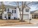 Two-story house with attached garage and landscaping at 2219 Kirkgate Ln, Charlotte, NC 28215