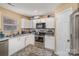 Well-equipped kitchen with white cabinets and stainless steel appliances at 2219 Kirkgate Ln, Charlotte, NC 28215