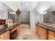 Bathroom with double vanity, soaking tub, and granite countertops at 2310 La Maison Dr, Charlotte, NC 28226