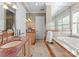 Spa-like bathroom with soaking tub, double vanity, and marble flooring at 2310 La Maison Dr, Charlotte, NC 28226