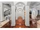 Elegant hallway with hardwood floors and architectural details at 2310 La Maison Dr, Charlotte, NC 28226