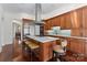 Gourmet kitchen featuring island, stainless steel appliances, and wood cabinetry at 2310 La Maison Dr, Charlotte, NC 28226