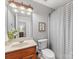 Bathroom with toilet, shower and wood vanity at 353 Killian Ct, Matthews, NC 28104