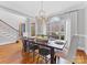 Bright dining room with large windows and chandelier at 353 Killian Ct, Matthews, NC 28104