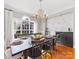 Elegant dining room with dark wood table and gray wall at 353 Killian Ct, Matthews, NC 28104