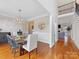 Formal dining room features a large table and chandelier at 353 Killian Ct, Matthews, NC 28104