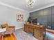 Spacious home office with wood desk and gray wall at 353 Killian Ct, Matthews, NC 28104