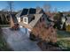 Brick house exterior with three-car garage and landscaping at 353 Killian Ct, Matthews, NC 28104