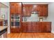 Kitchen boasts stainless steel appliances and wood cabinetry at 353 Killian Ct, Matthews, NC 28104