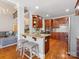 Island kitchen features granite countertops and breakfast bar at 353 Killian Ct, Matthews, NC 28104