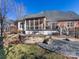 Stone patio with seating area and fire pit, perfect for outdoor entertaining at 353 Killian Ct, Matthews, NC 28104