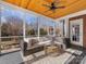 Relaxing screened porch with wicker furniture at 353 Killian Ct, Matthews, NC 28104