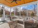 Spacious screened porch with wicker furniture and view at 353 Killian Ct, Matthews, NC 28104