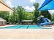 Community swimming pool with waterslide and playground at 353 Killian Ct, Matthews, NC 28104