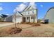 Two-story house with gray siding, white trim, landscaping, and a two-car garage at 414 Shallowford Dr # 44, Rock Hill, SC 29732