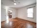 Bright bedroom with hardwood floors and ceiling fan at 535 Brooklyn Ave, Cramerton, NC 28032