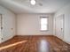 Bright bedroom with hardwood floors, ceiling fan, and ample natural light at 535 Brooklyn Ave, Cramerton, NC 28032