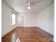 Well-lit bedroom with hardwood floors and a ceiling fan at 535 Brooklyn Ave, Cramerton, NC 28032