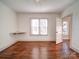 Bright bedroom with hardwood floors and two windows at 535 Brooklyn Ave, Cramerton, NC 28032