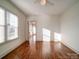 Bright bedroom with hardwood floors and access to sunroom at 535 Brooklyn Ave, Cramerton, NC 28032