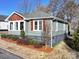 Gray craftsman home with a landscaped yard and wood accents at 535 Brooklyn Ave, Cramerton, NC 28032