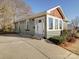 Updated home with a new driveway, landscaping, and gray siding at 535 Brooklyn Ave, Cramerton, NC 28032