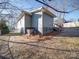 Single story home with gray siding, wood accents, and landscaping at 535 Brooklyn Ave, Cramerton, NC 28032