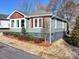 Ranch style home with gray siding, shutters, and landscaping at 535 Brooklyn Ave, Cramerton, NC 28032