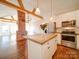 Modern kitchen with white cabinets and concrete island at 535 Brooklyn Ave, Cramerton, NC 28032