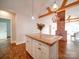 Modern kitchen with white cabinets and concrete island at 535 Brooklyn Ave, Cramerton, NC 28032