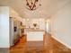 Modern kitchen with white cabinets and concrete island at 535 Brooklyn Ave, Cramerton, NC 28032