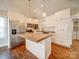 Modern kitchen with white cabinets and concrete island at 535 Brooklyn Ave, Cramerton, NC 28032