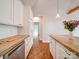 Modern kitchen with white cabinets and concrete island at 535 Brooklyn Ave, Cramerton, NC 28032