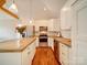 Modern kitchen with white cabinets and concrete island at 535 Brooklyn Ave, Cramerton, NC 28032