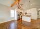 Modern kitchen with white cabinets and concrete island at 535 Brooklyn Ave, Cramerton, NC 28032